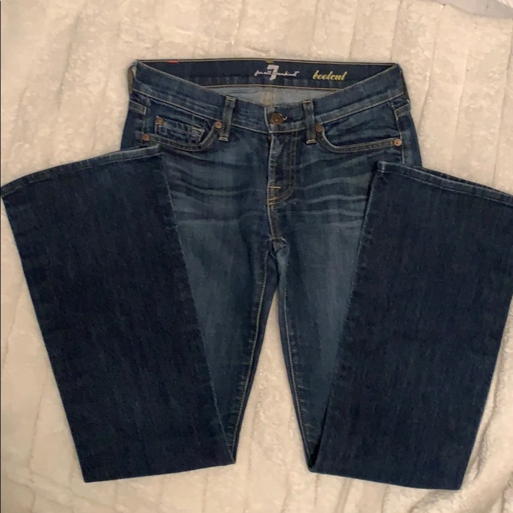 7 FAMK Medium wash bootcut jeans.